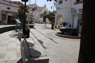 A serene Spanish town square symbolizing calm and trust in the community.