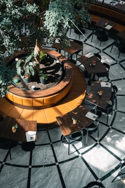 a courtyard with tables and chairs