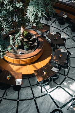 a courtyard with tables and chairs