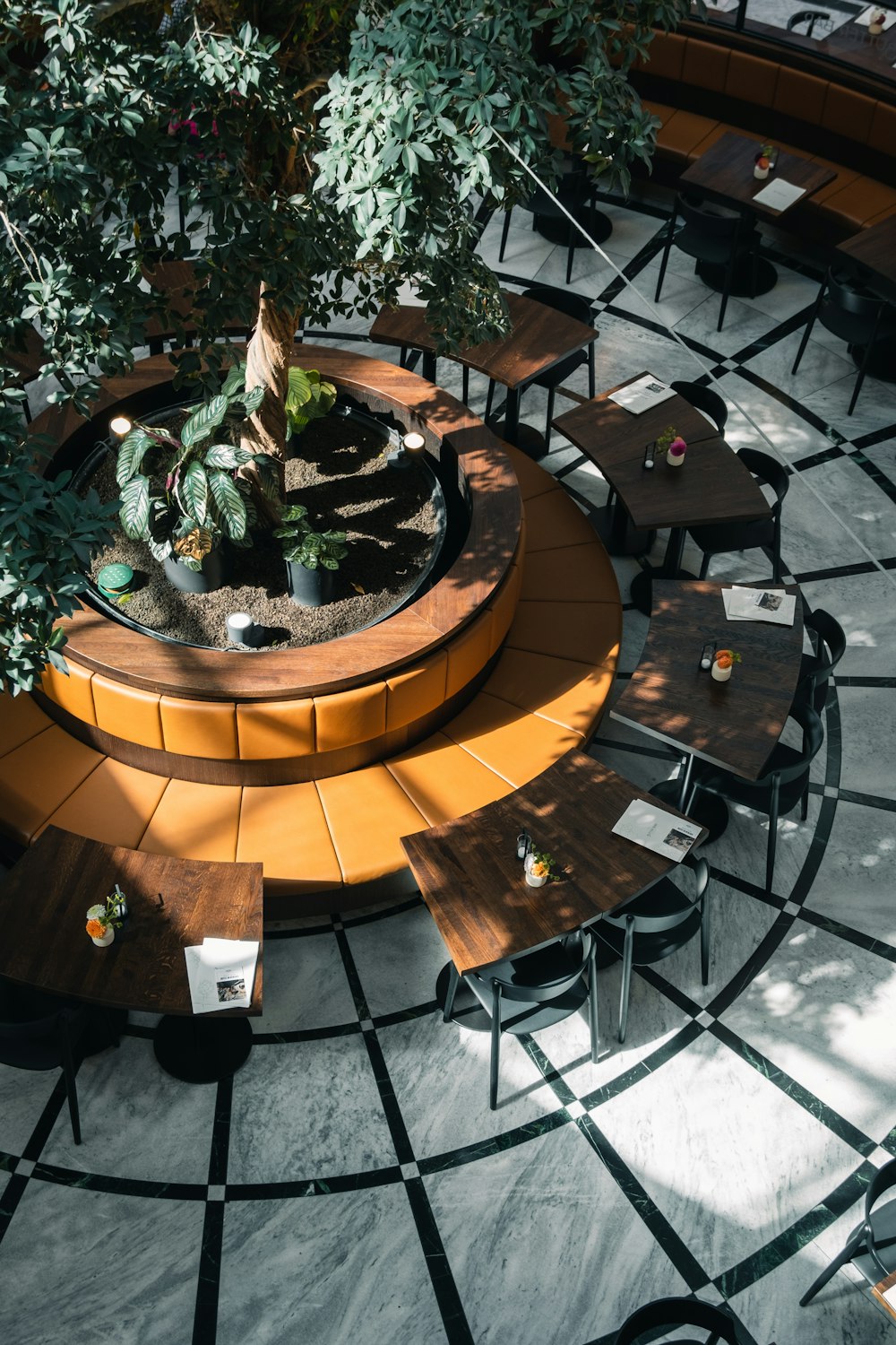 a courtyard with tables and chairs