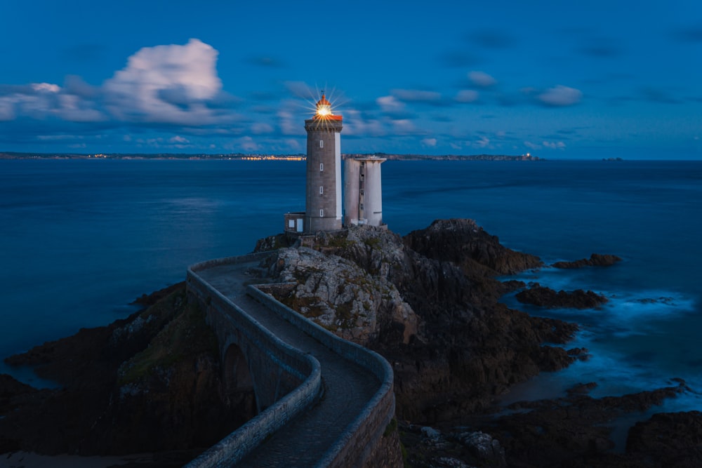 a lighthouse on a rocky cliff