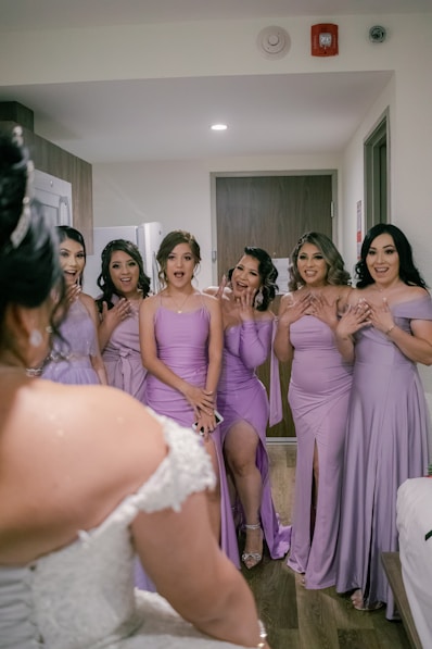 a group of women in dresses
