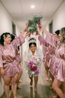 a group of people in pink suits