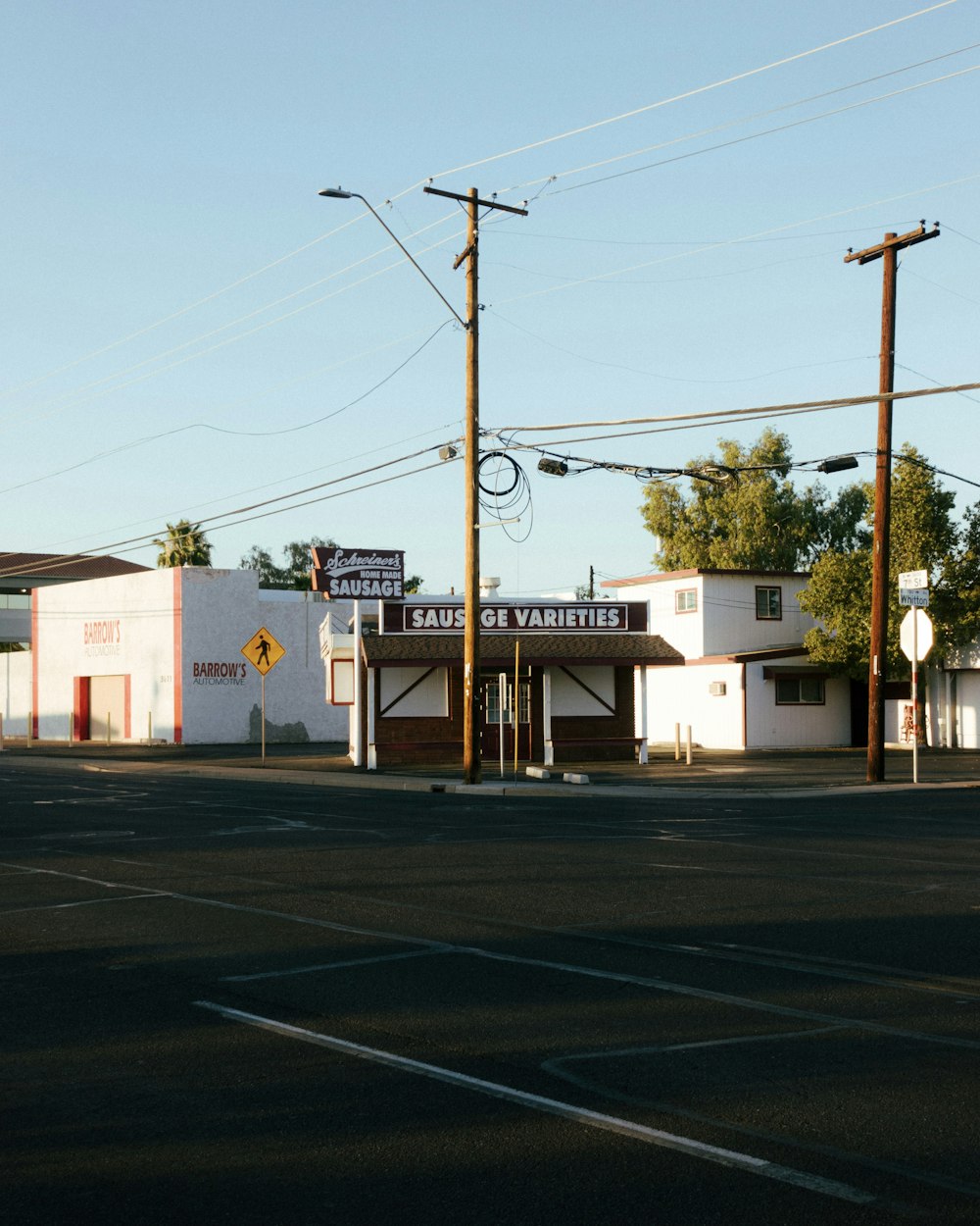 a small store on the corner of a street