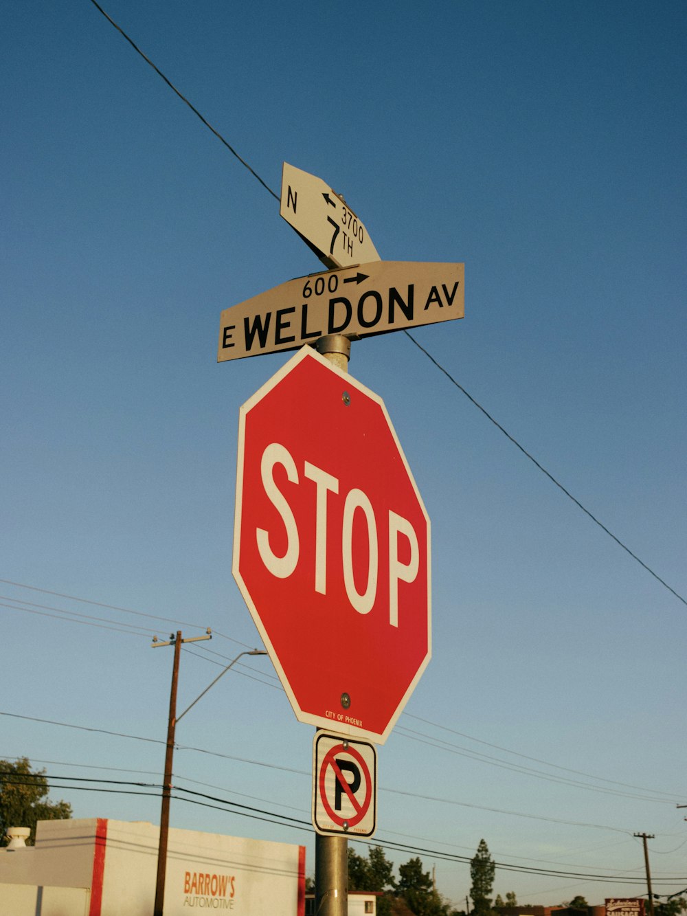 a stop sign with street signs on it