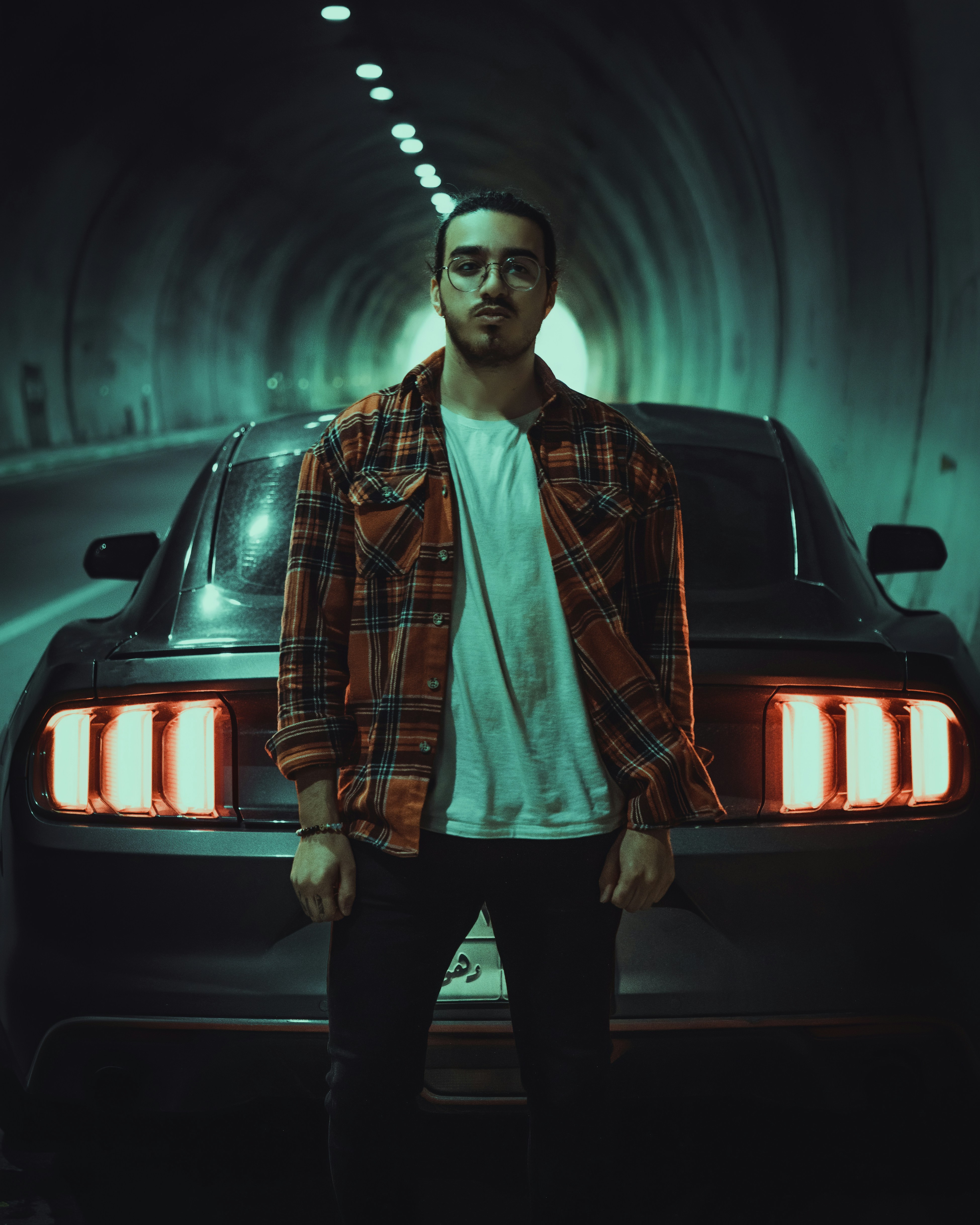 a person standing next to a car