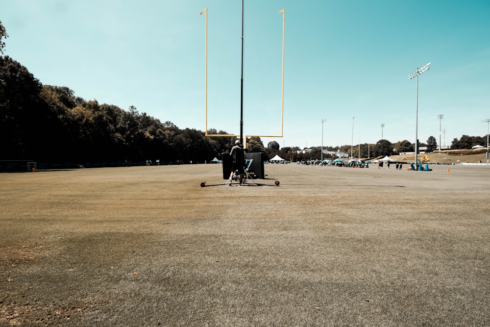 a couple of people on a skateboard in a field