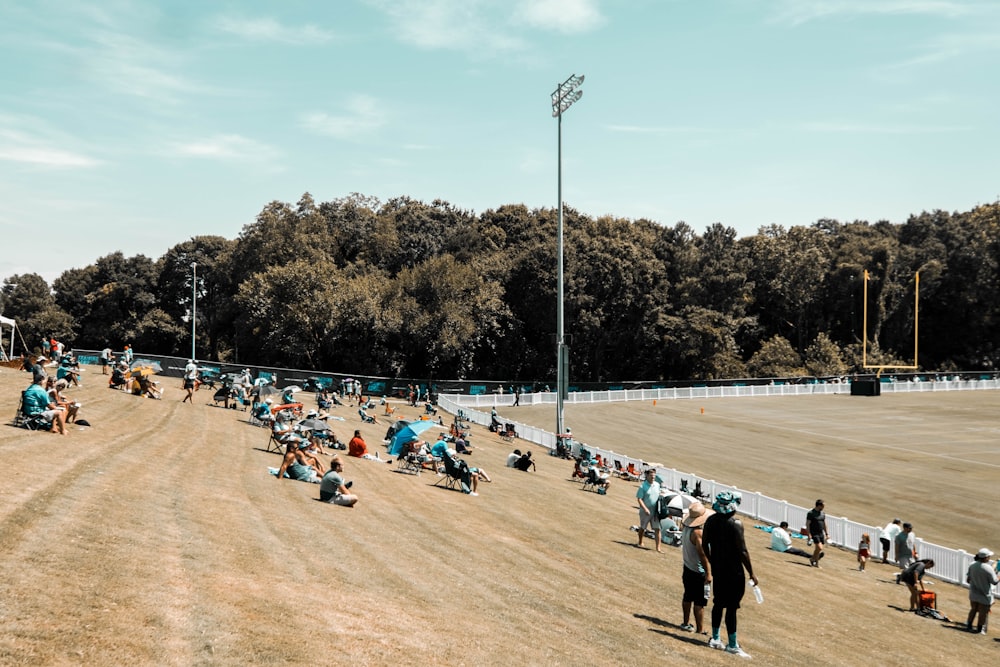 a group of people on a dirt track