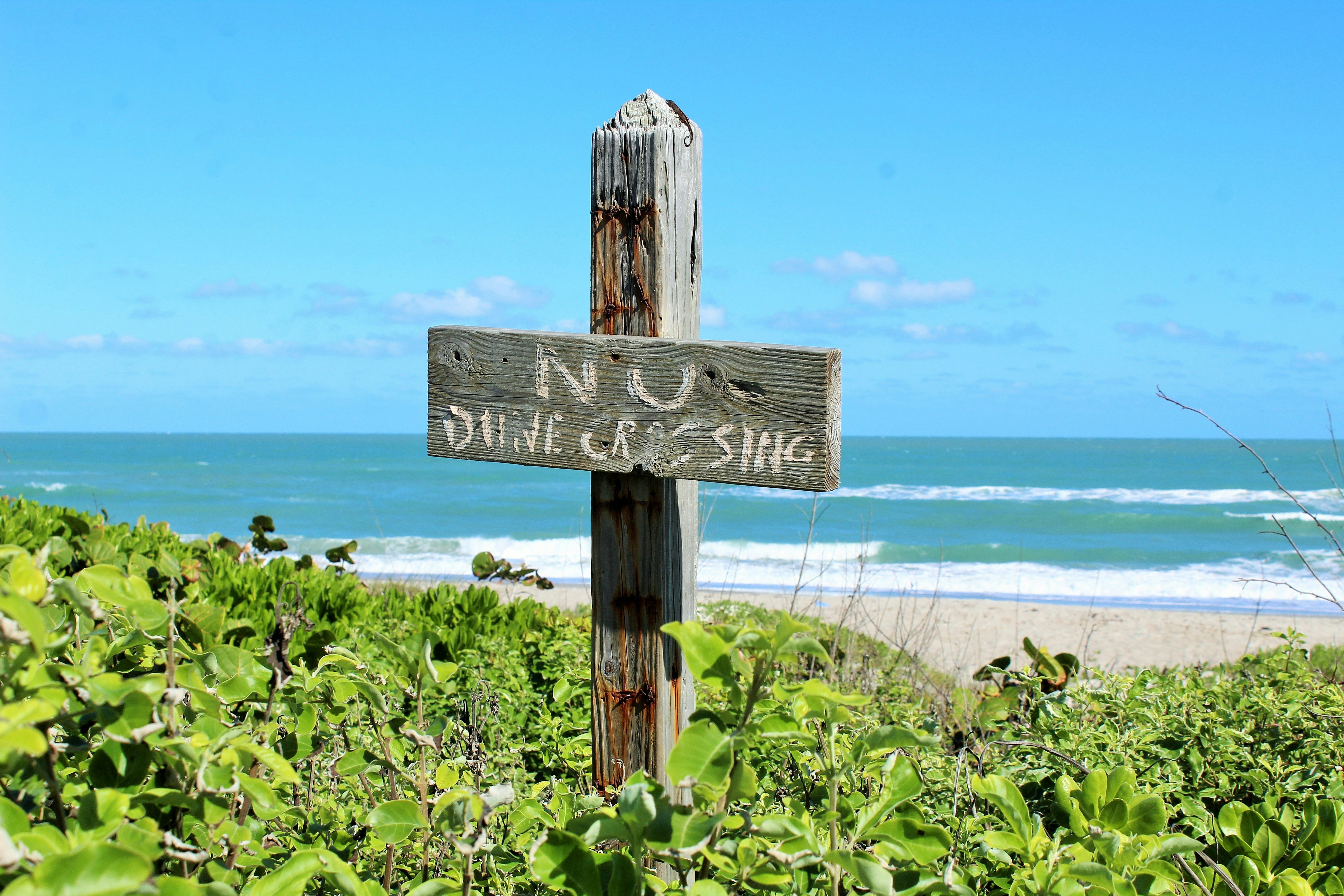 a sign on a beach