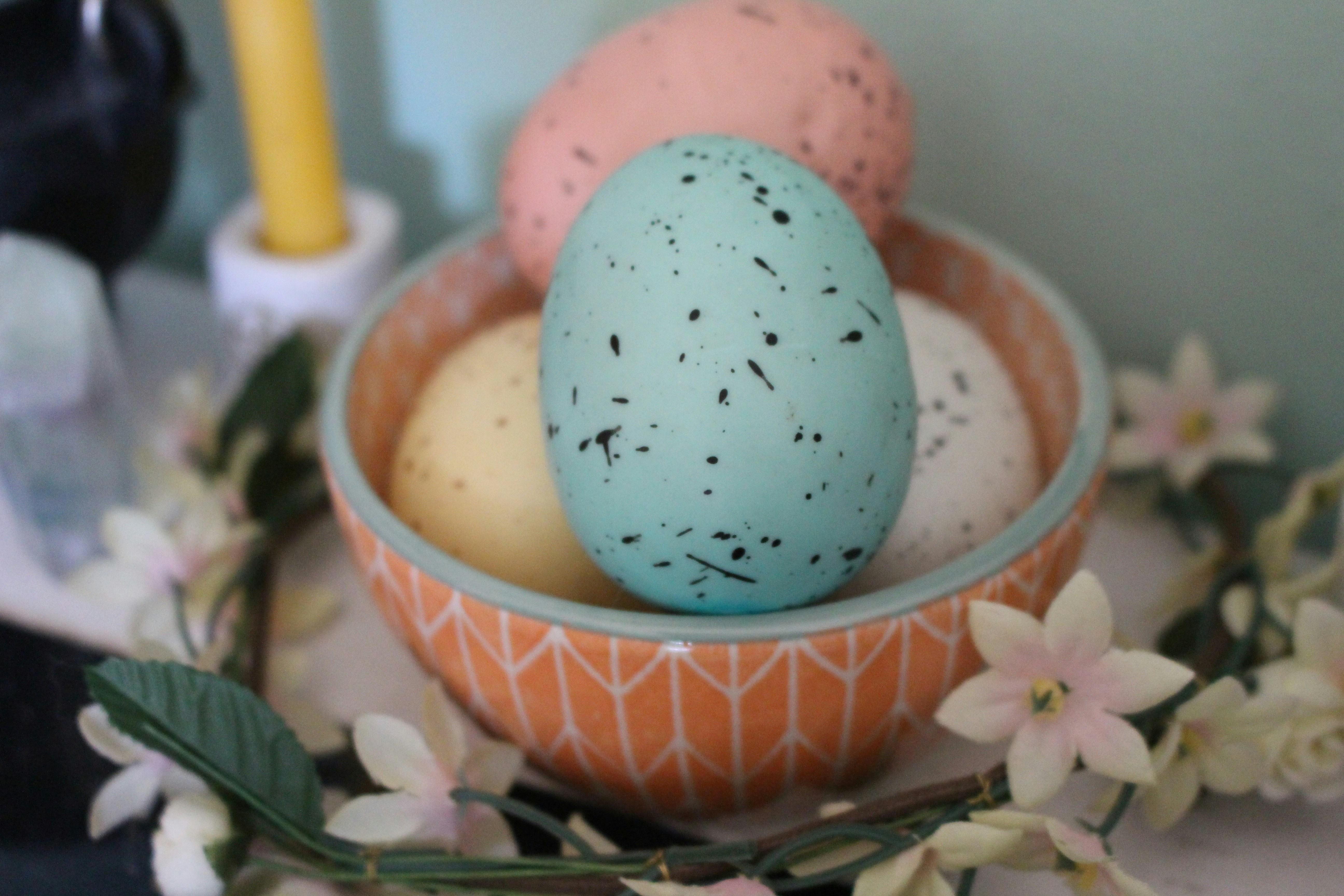 Bowl of speckled eggs with flowers