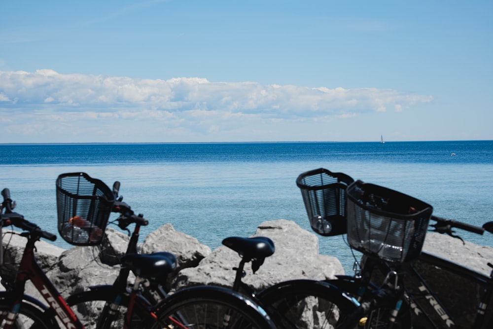 a group of bicycles parked on a beach