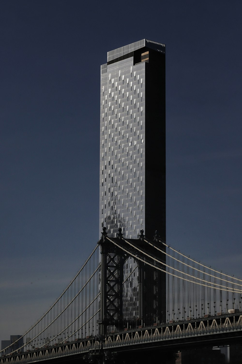 a tall building with a bridge