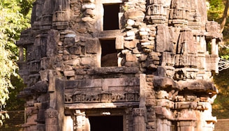 A detailed photograph of an ancient megalithic structure at sunrise, highlighting its weathered stones and mysterious carvings.