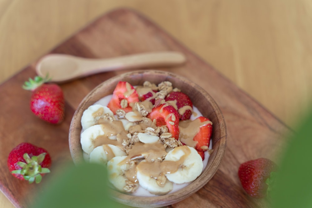 a bowl of cereal with strawberries