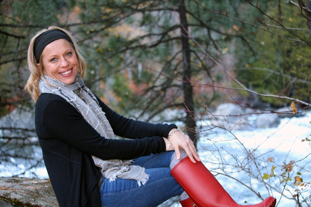 a woman holding a red bucket