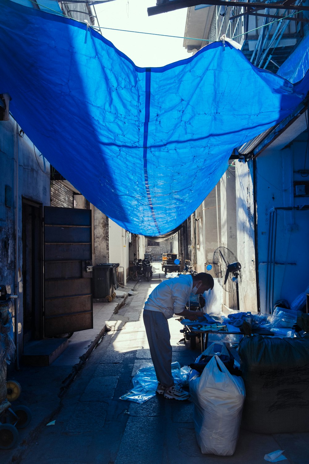 a person in a blue tarp