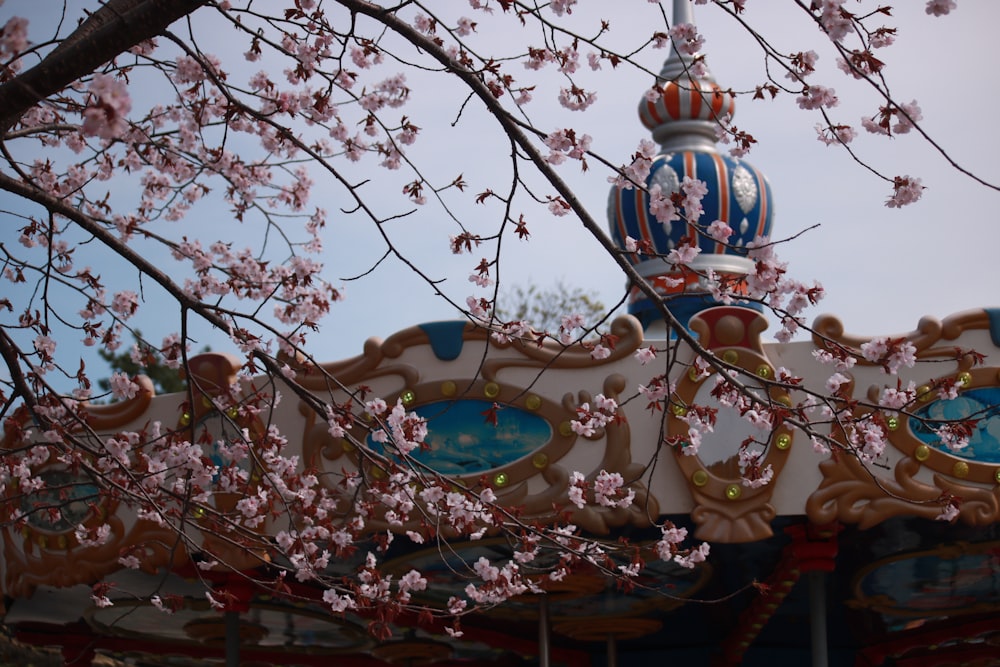 a tree with flowers and a lamp