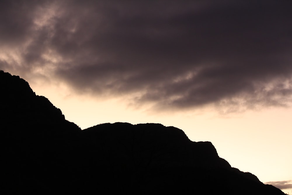 a mountain with clouds