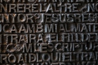 Close-up of a custom 3D printed nameplate with intricate lettering and smooth edges.