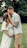 a man and woman kissing