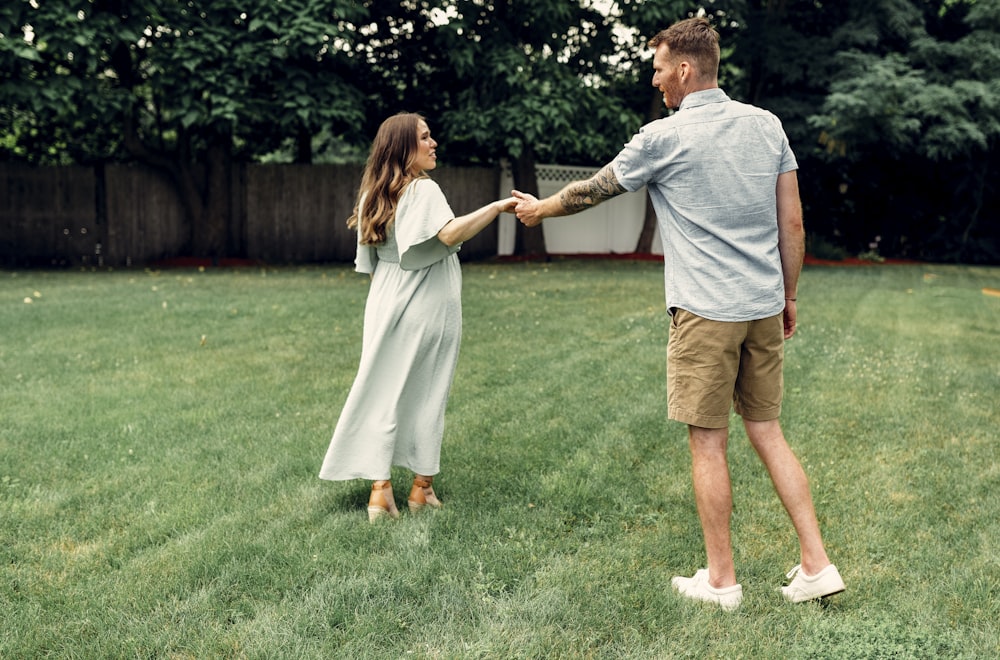 a man and a woman holding hands