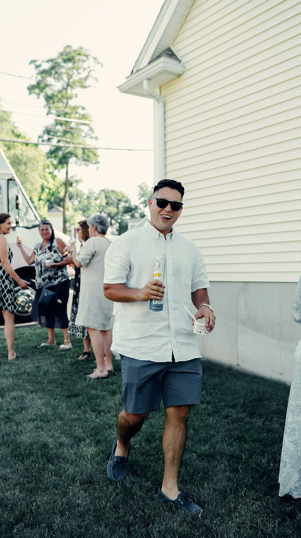 a person holding a bottle of beer