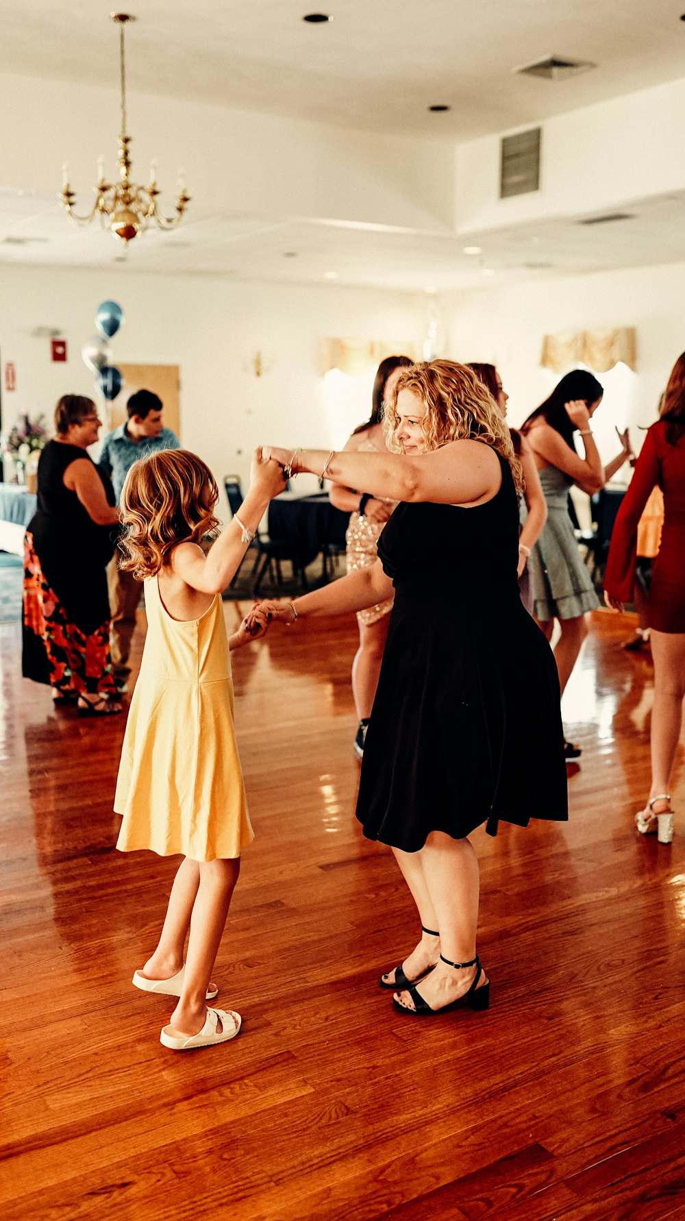 a person and a child dancing