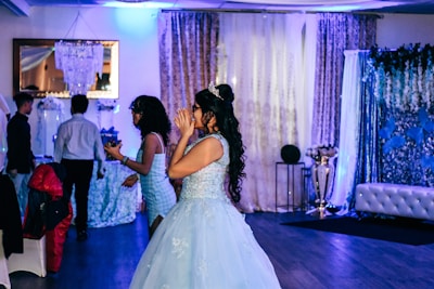 Charming debutante party with elegant decorations and joyful young woman in a sophisticated dress.