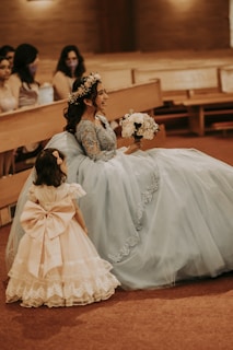 a person in a white dress and a girl in a white dress