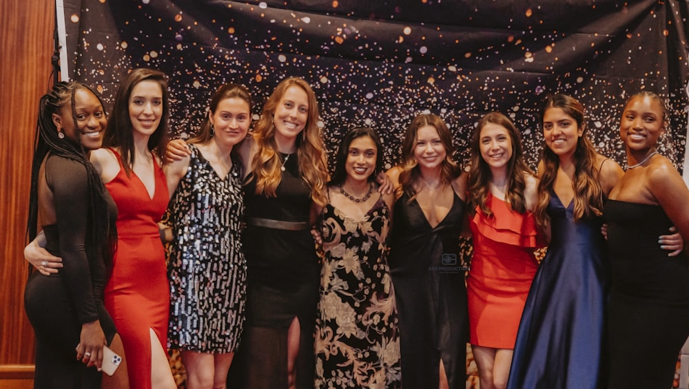 a group of women posing for a photo