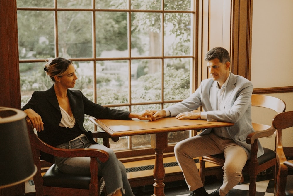 a man and a woman sitting at a table