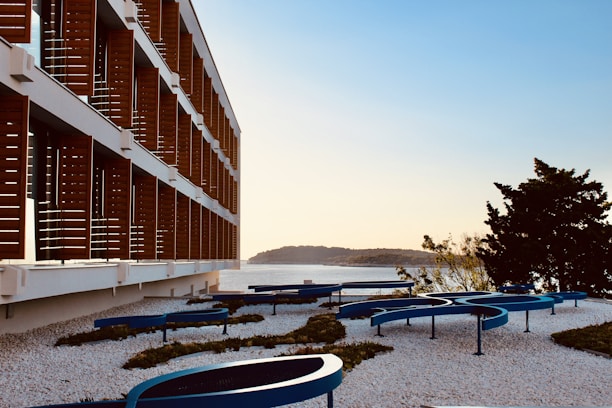 A modern marble building with a view of the Aegean Sea.