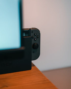 Close-up of a refurbished Nintendo Switch with vibrant screen display