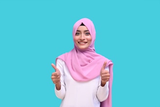 a person wearing a pink head scarf