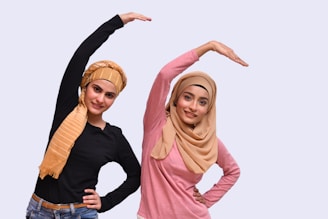 a couple of women posing for the camera