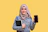 a person holding a phone and a tablet