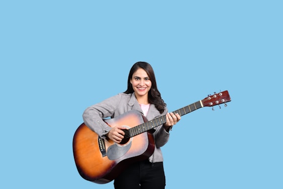 a person holding a guitar