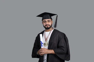a man wearing a cap and gown