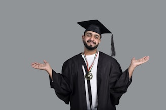 a man wearing a graduation cap and gown