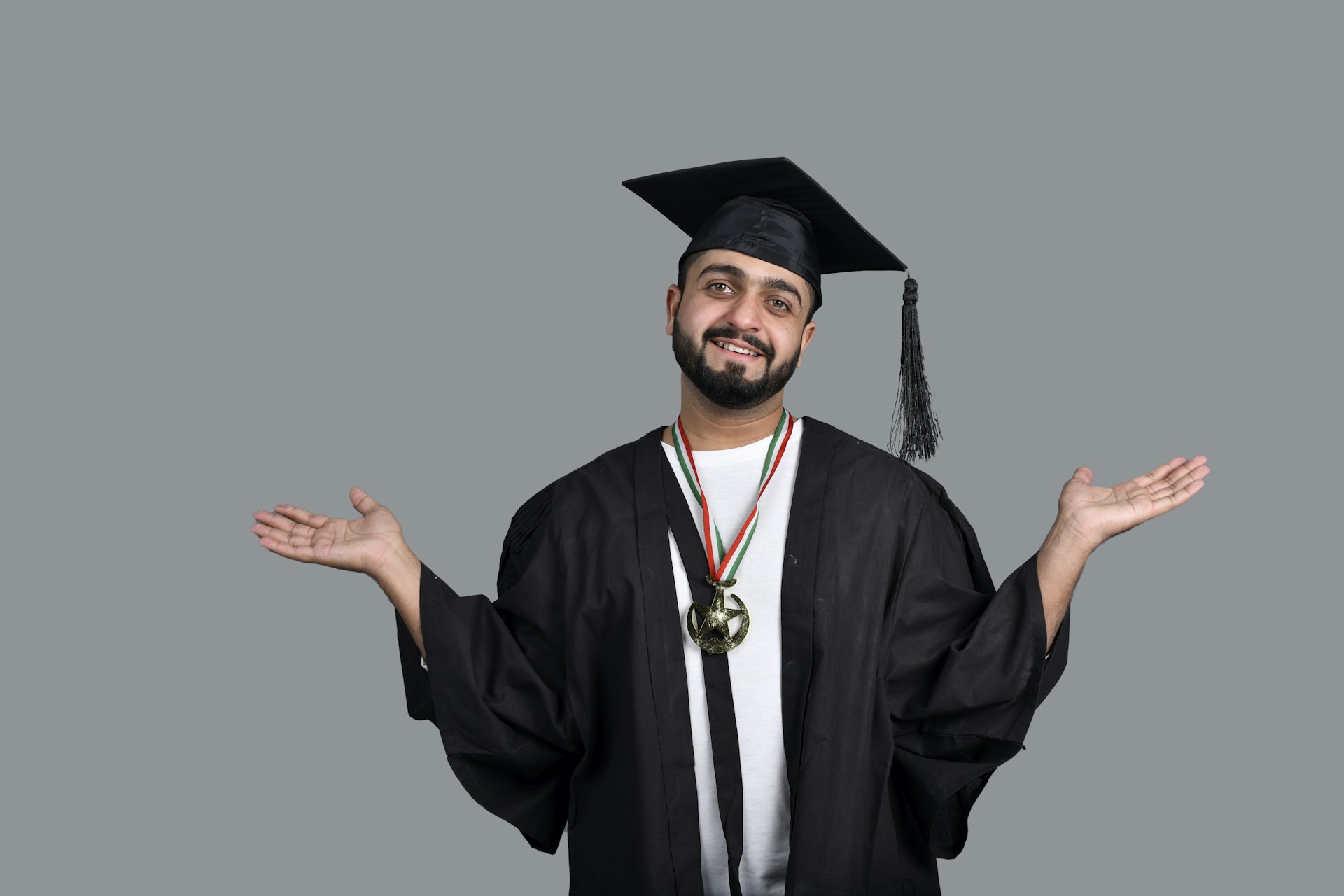 a man wearing a graduation cap and gown