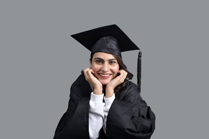a person wearing a graduation cap and gown