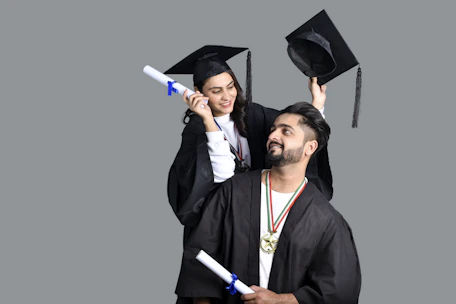 a man and woman wearing graduation gowns and caps