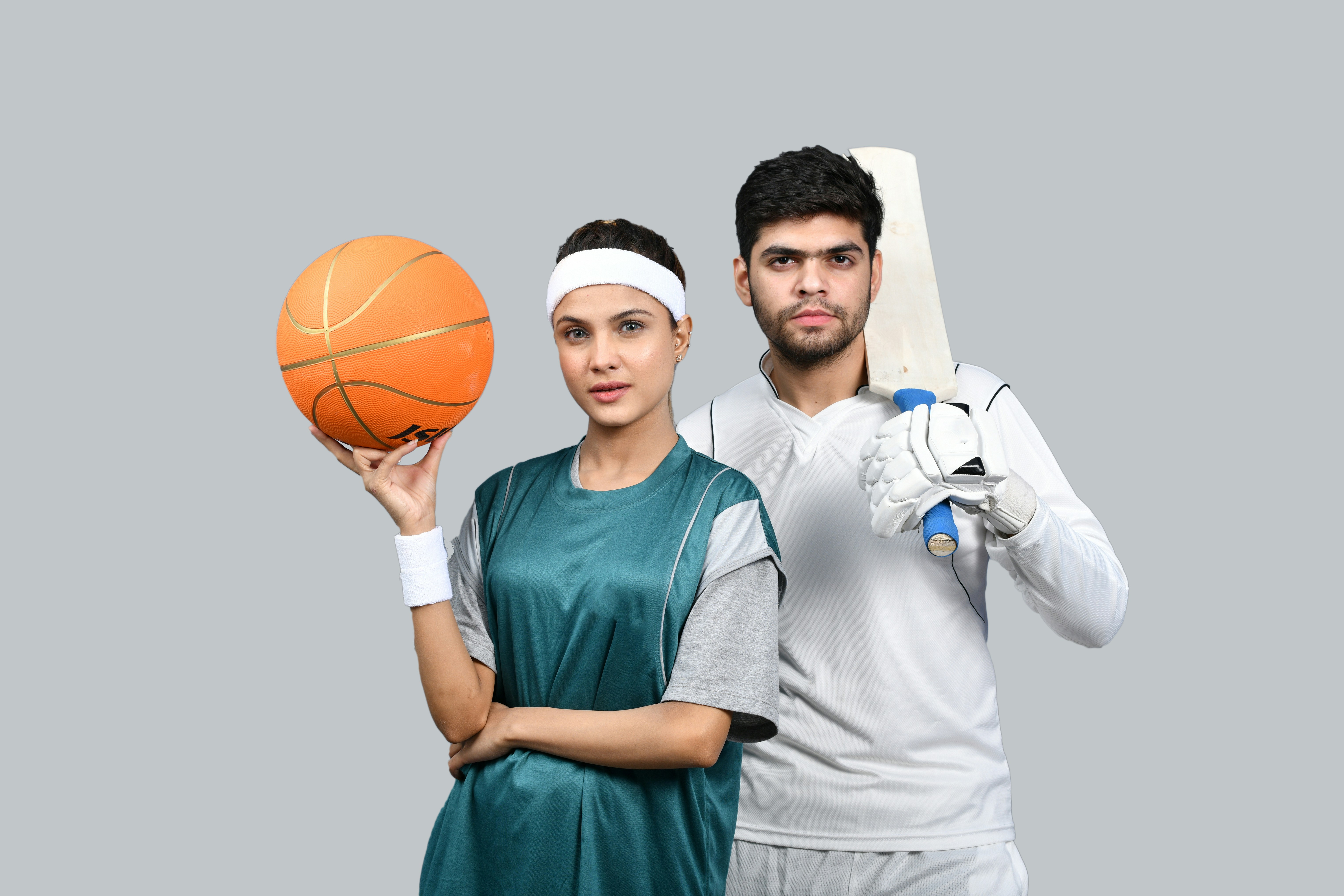 a man and woman holding a basketball together