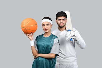 a man and a woman holding a basketball