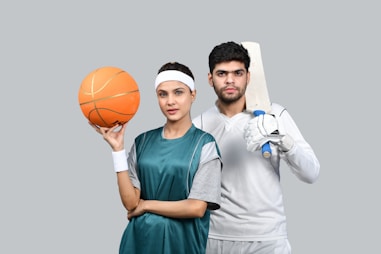 a man and a woman holding a basketball