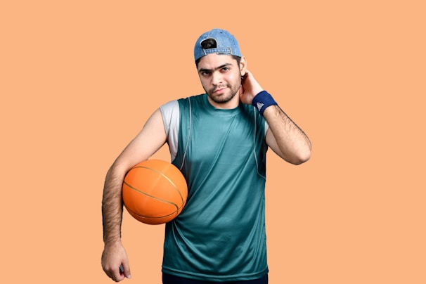 Close-up of basketball player adjusting a compression arm sleeve