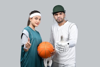 a man and a woman holding a basketball
