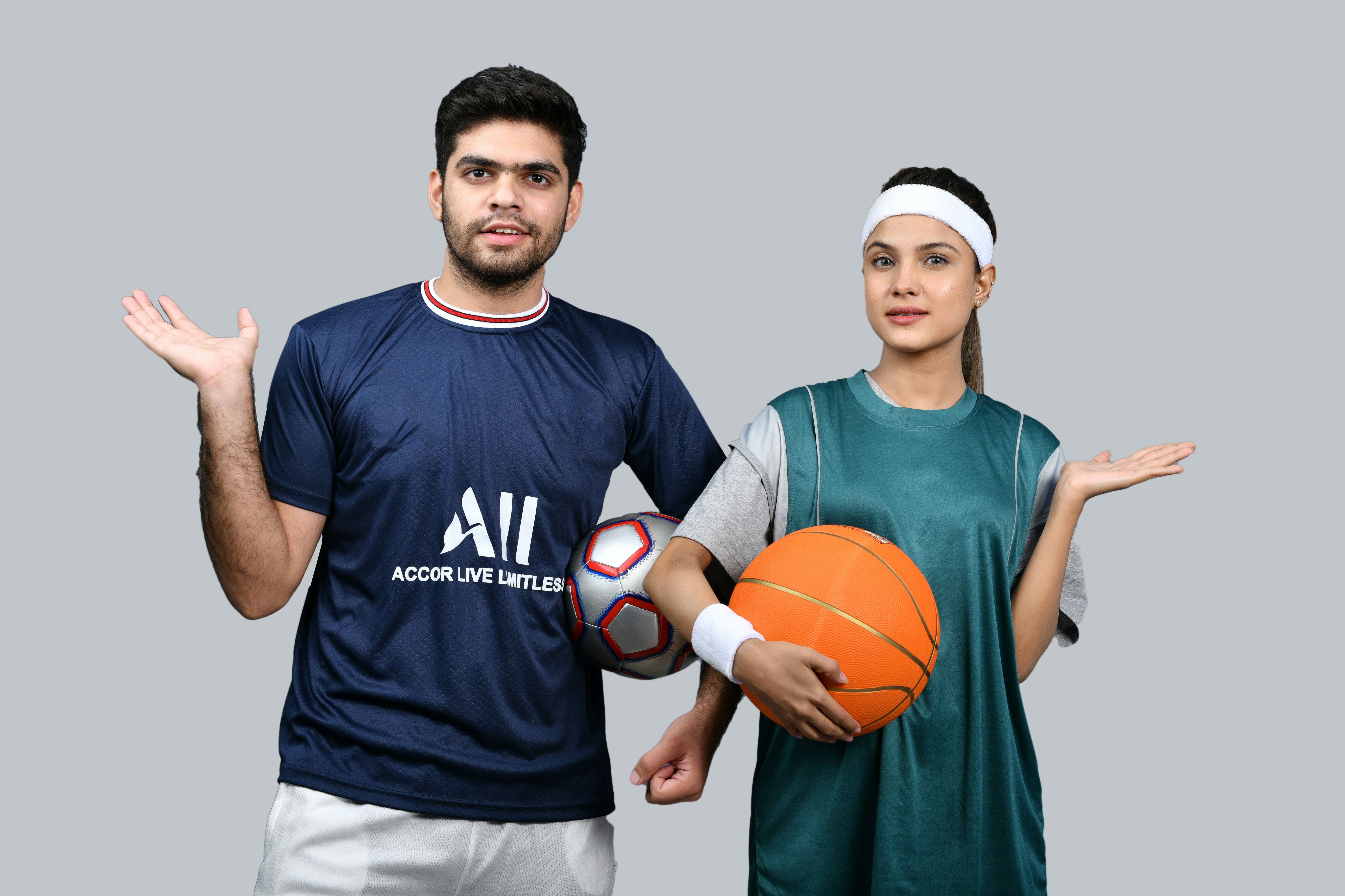 a man and woman holding a basketball together