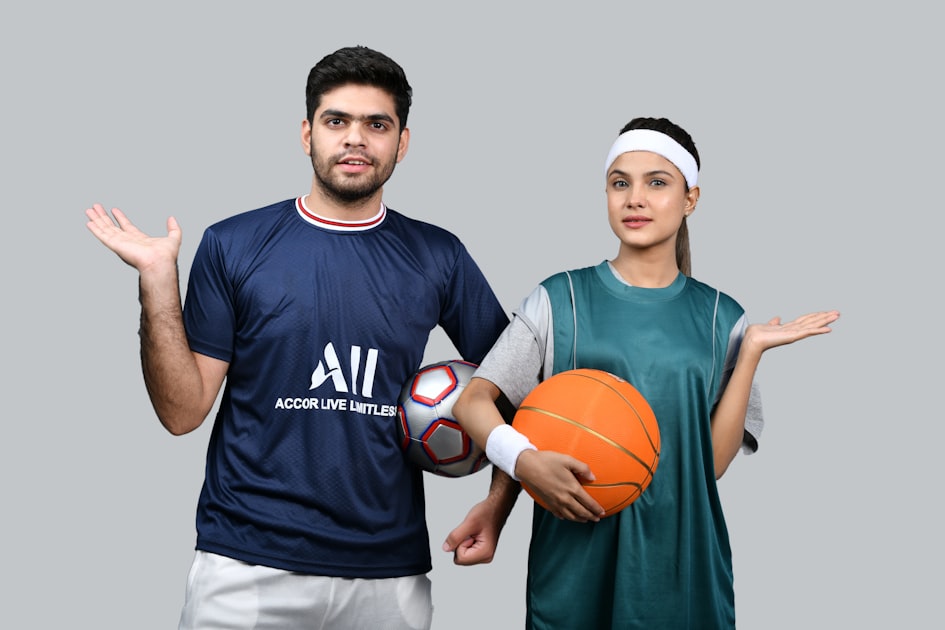 a man and a woman holding a basketball