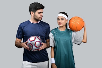 a man and a woman holding a basketball